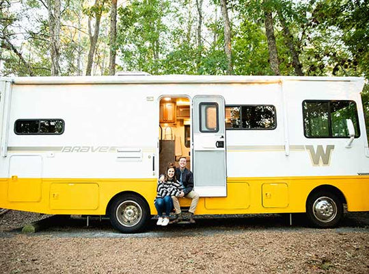 Couple in Motorhome Being Leveled with SnapPad XTRA