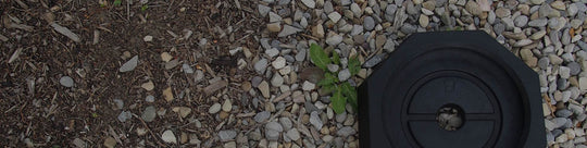 single SnapPad lies on a mulch and gravel covered ground