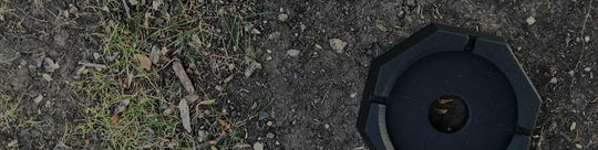 single SnapPad lies on a dirt and twig covered ground