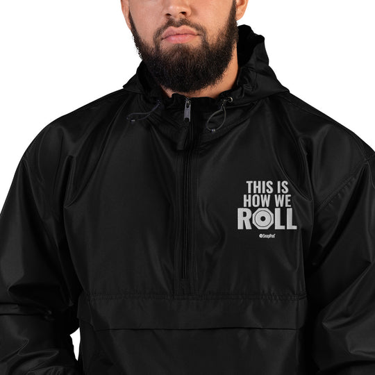 Man wearing Black compact SnapPad rain jacket