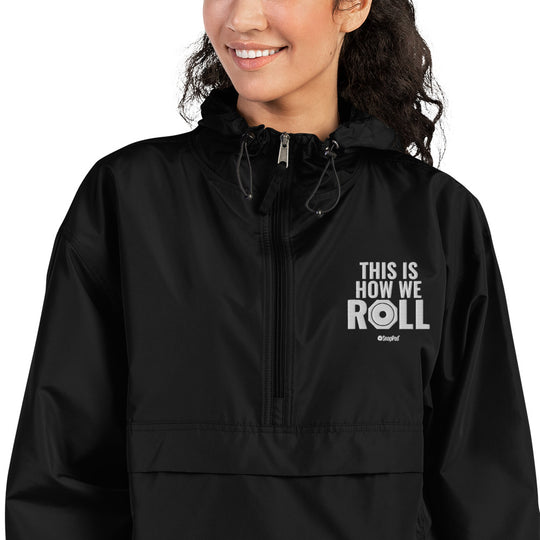 Woman wearing Black compact SnapPad rain jacket